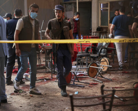 Explosive device goes off in cafe in Syria's capital, killing at least 9 people
