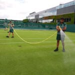Wimbledon kept its courts lush green as other London lawns browned in record heat