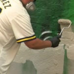 Artist repairs mural of Giannis Antetokounmpo in downtown Milwaukee after vandalism