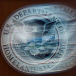 US Department of Homeland Security says it is probing a cyber breach at information-sharing network