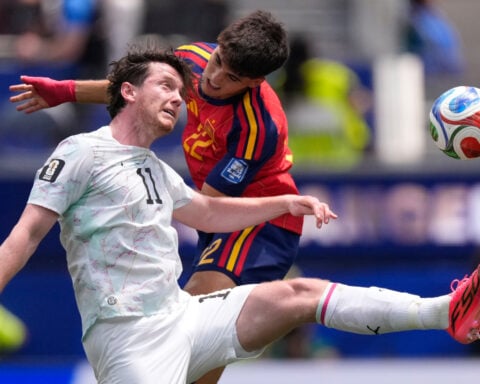 Mikel Oyarzabal's 2 goals send dominant Spain past Austria 3-0 and into round of 16 at the World Cup