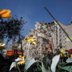 Ukrainian rescuers clear rubble as Kyiv mourns 30 killed in Russian attack