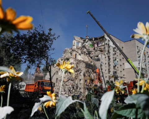 Ukrainian rescuers clear rubble as Kyiv mourns 30 killed in Russian attack