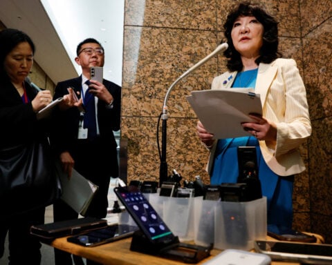 Japan keeps yen intervention threat alive, says in close touch with US
