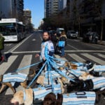 Puppy love as dog walker turns his pack of 13 into Argentina jersey-clad World Cup followers