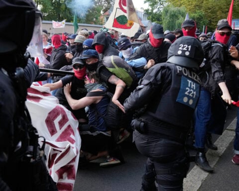 Far-right Alternative for Germany party reelects leaders as protesters and police clash