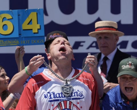 Joey Chestnut eats 66 hot dogs to again claim Mustard Belt at Nathan's Famous contest