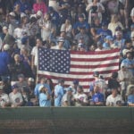 Cubs fans sing `Take Me Home, Country Roads' during fog delay at Wrigley Field