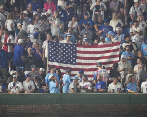 Cubs fans sing `Take Me Home, Country Roads' during fog delay at Wrigley Field