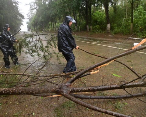 Heavy rains leave 5 dead in China's north while Tropical Storm Maysak hits the south and Vietnam
