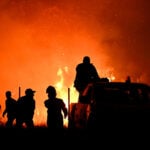 Hundreds of firefighters battle a wildfire in Portugal, while Greek authorities warn of toxic smoke