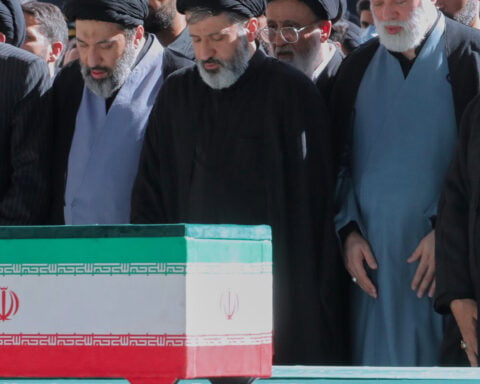 Khamenei's other sons appear at his funeral in Iran as new supreme leader remains in hiding