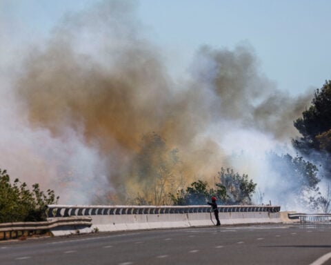 French wildfires force officials to ban public from Tour de France's third stage