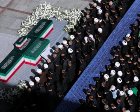 Three sons of Iran's slain leader Khamenei appear at funeral, not his successor