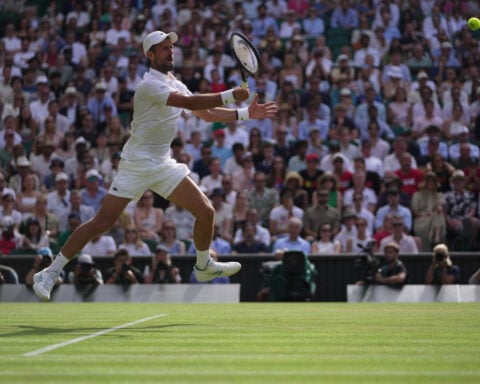 Djokovic breaks Federer's Wimbledon record with 106th match win to reach quarterfinals