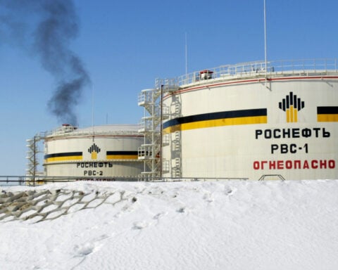 7 OPEC+ countries agree to expand monthly oil production modestly as prices slide
