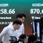 US futures and Asian shares are mixed while oil prices decline as some exporters opt to raise output