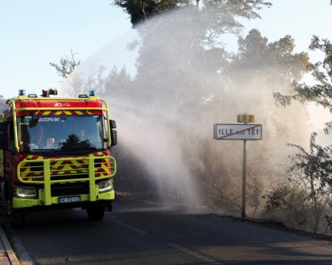 French wildfires force officials to ban public from Tour de France's third stage