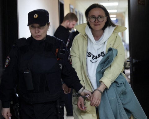 Husband of jailed Russian playwright keeps lonely vigil in exile