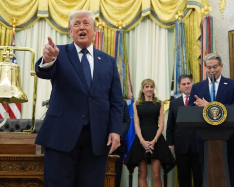 Trump rings Wall Street's opening bells as he ties his presidency to stock market gains