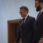 Explosions rock Damascus, wounding 4, as French President Macron visits Syria