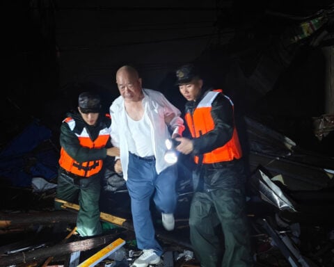 Man blown from 12th-floor apartment as deadly tornado rips through central China