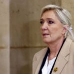 French court clears a path for Le Pen to run for office but upholds conviction
