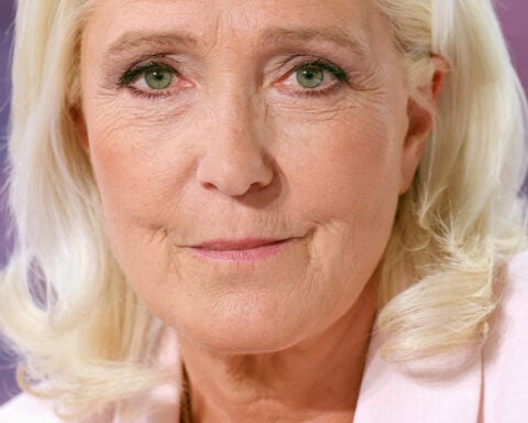 Le Pen says she'll run for French presidency next year despite court-ordered monitor