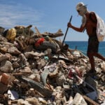 Venezuelan volunteers dig graves for quake victims as US defends government relief effort