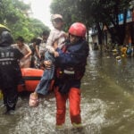 A southern Chinese region reels from floods and destruction from remnants of tropical storm