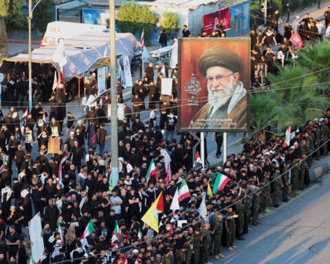 Thousands march as Khamenei's funeral procession crosses into Iraq