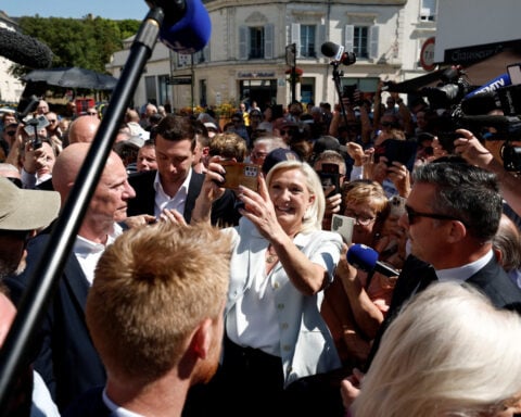 Cheers and boos for Le Pen's French campaign launch after guilty verdict