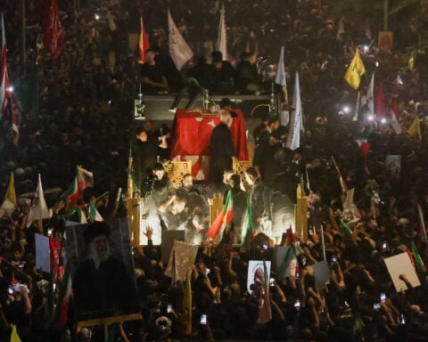 Thousands march as Khamenei's funeral procession crosses into Iraq