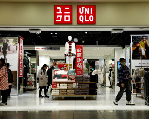 Uniqlo operator Fast Retailing cautions on yen and heatwaves, but raises profit forecast