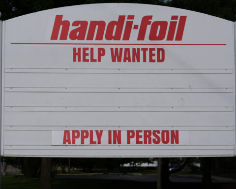 US jobless claims dip modestly to 215,000 last week as layoffs remain at historically healthy levels