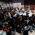 Gazans mourn aid worker killed by Israel who brought them the World Cup