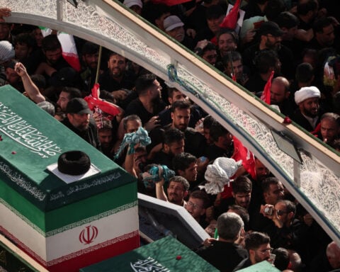 Iran says it hits US military targets in Gulf, lays slain leader to rest