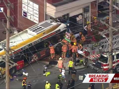 Bus crashes into 12 cars, building in Pikesville, leaving 35 injured in 'mass casualty incident'