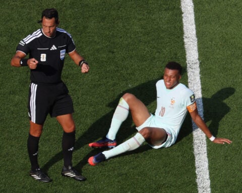 Kylian Mbappé scores his 8th World Cup goal before leaving game with a 'slight' ankle injury