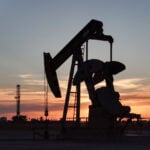 Crude up, chips down