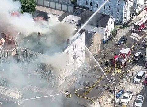 Firefighter saves man trapped on third floor of burning Lawrence home: "He had smoke coming out all around him"