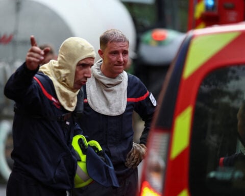 Wildfire rages near Paris as heatwave scorches Europe