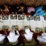 Indonesian free meals operators protest moratorium on new kitchens