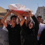Israel's latest strikes kill a dozen people in Gaza including police officers