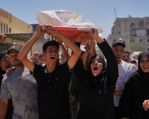 Israel's latest strikes kill a dozen people in Gaza including police officers