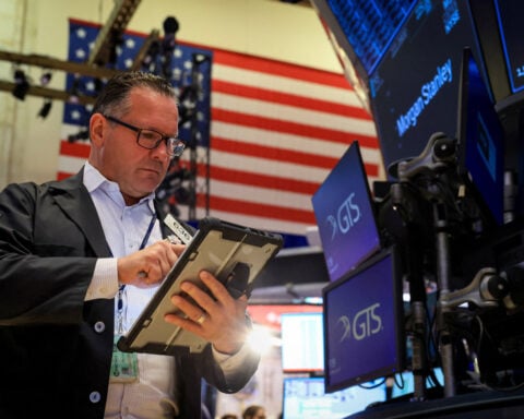 Wall St opens higher as investors weigh earnings; PayPal jumps