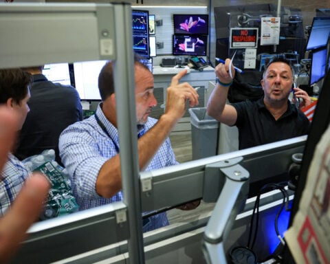 Chip selloff drags Wall Street lower, offsetting solid earnings, economic data