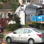 Tractor-trailer goes off road, slams into homes