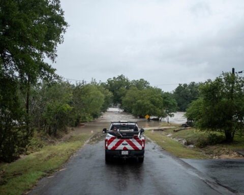At least 1 person has died as Texas flooding forces evacuations and rescues, governor says