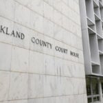 Michigan woman pleads no contest to abuse after 3 kids are found living alone for years